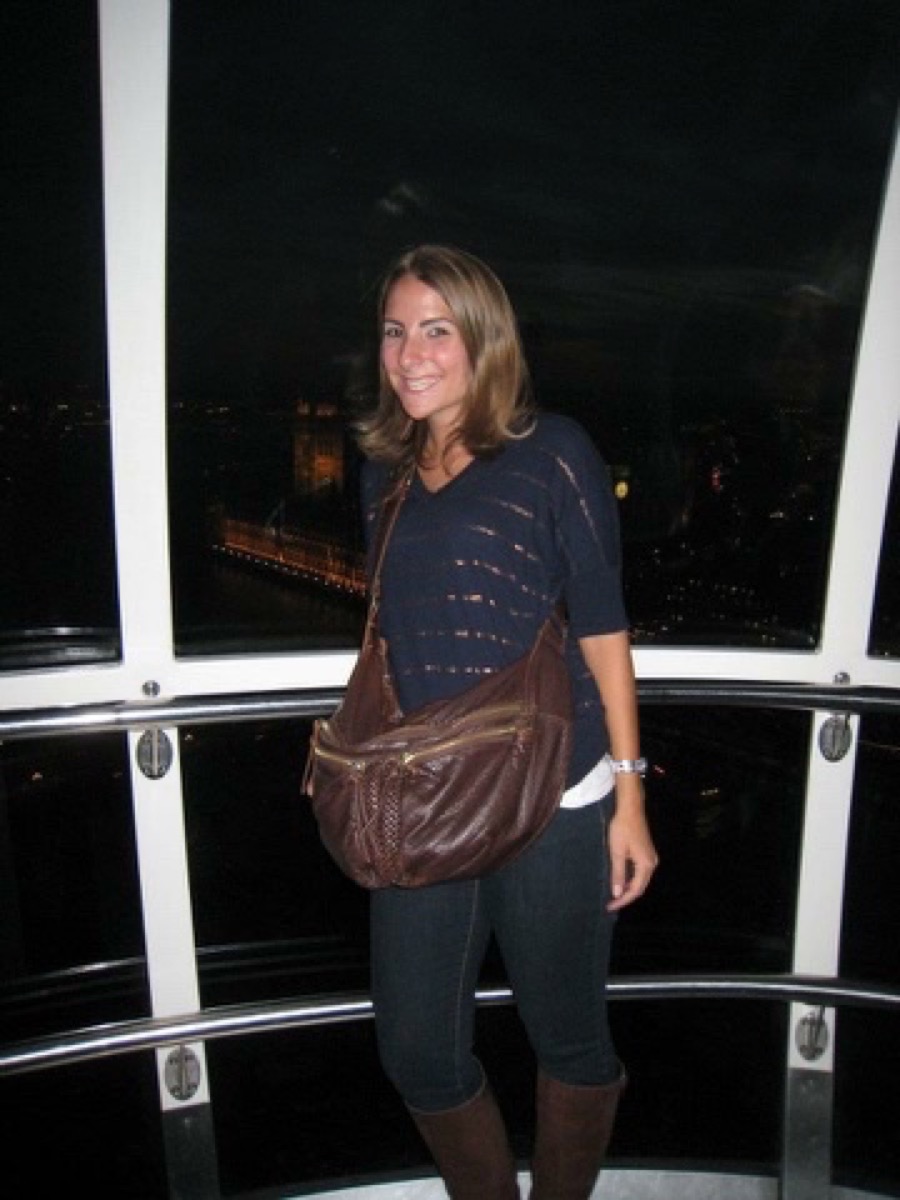 Kate smiling inside a London Eye pod at night, Houses of Parliament in the background