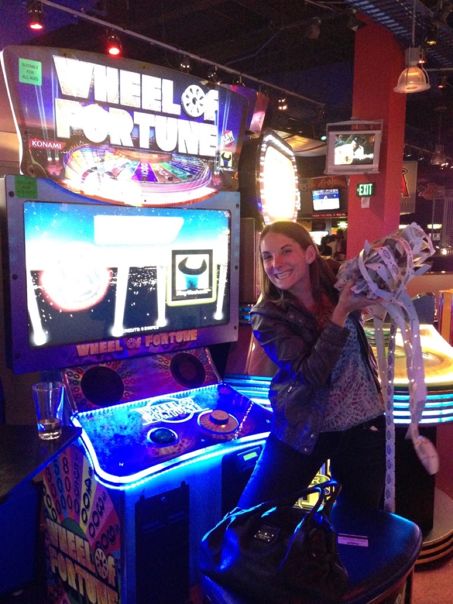 Kate with a huge bundle of arcade tickets at Wheel of Fortune