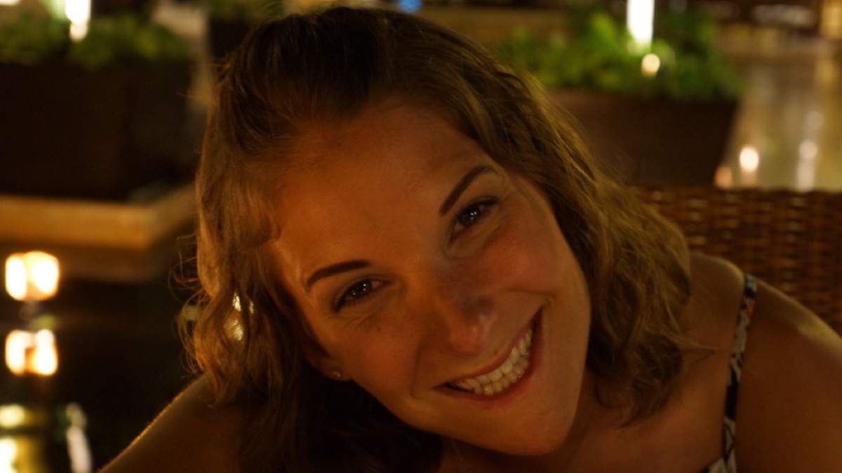 Kate smiling at dinner in Cancún
