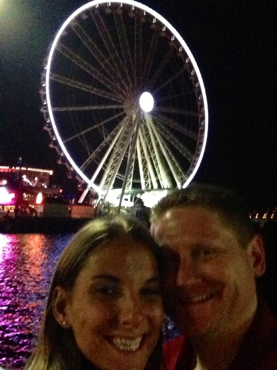 Kyle and Kate in Seattle with the Great Wheel behind them