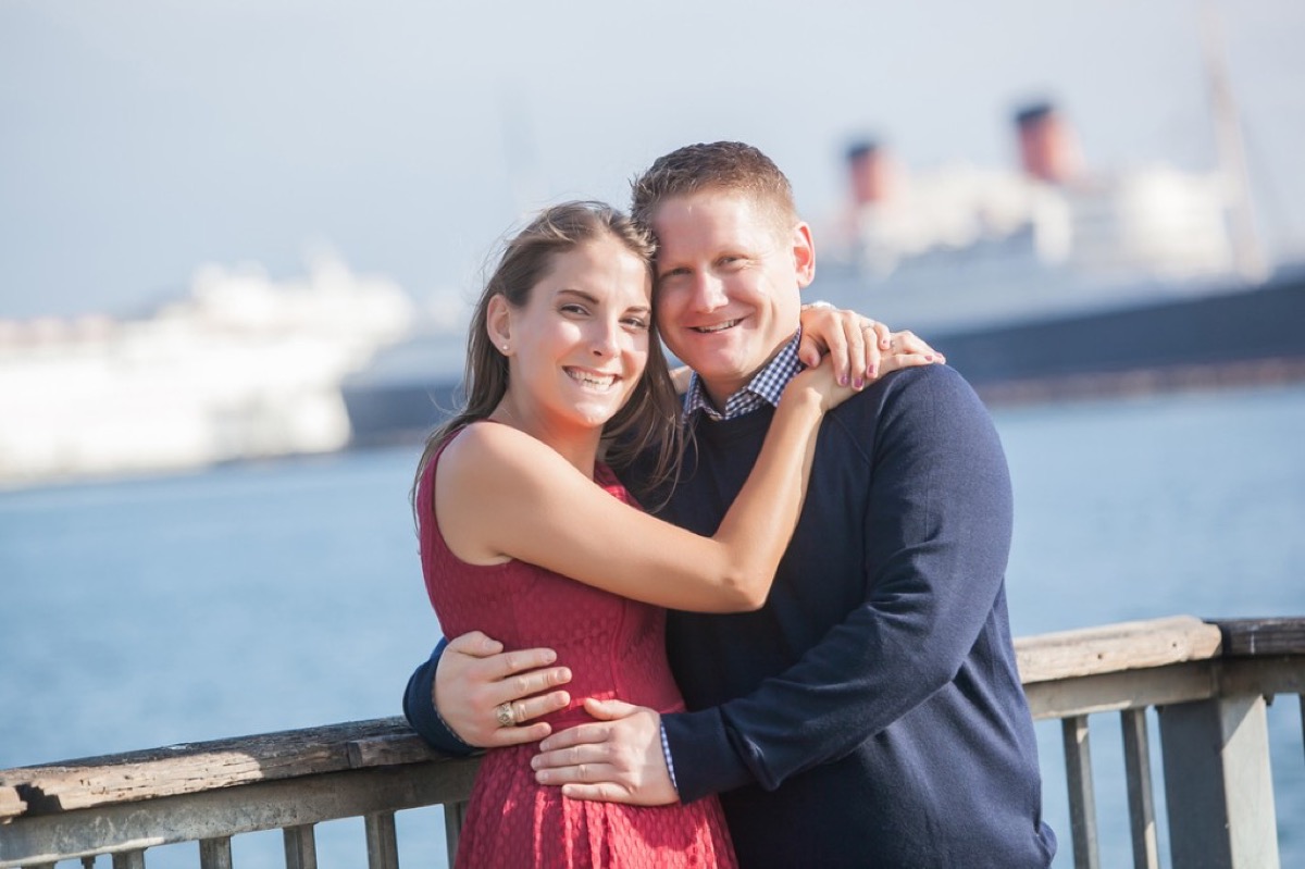 Kyle and Kate engagement portrait with the Queen Mary in the background