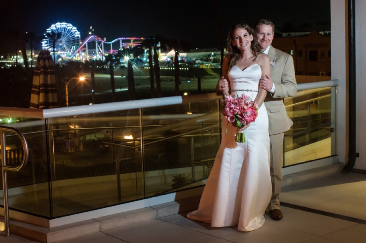 Kyle and Kate with the Santa Monica pier at night