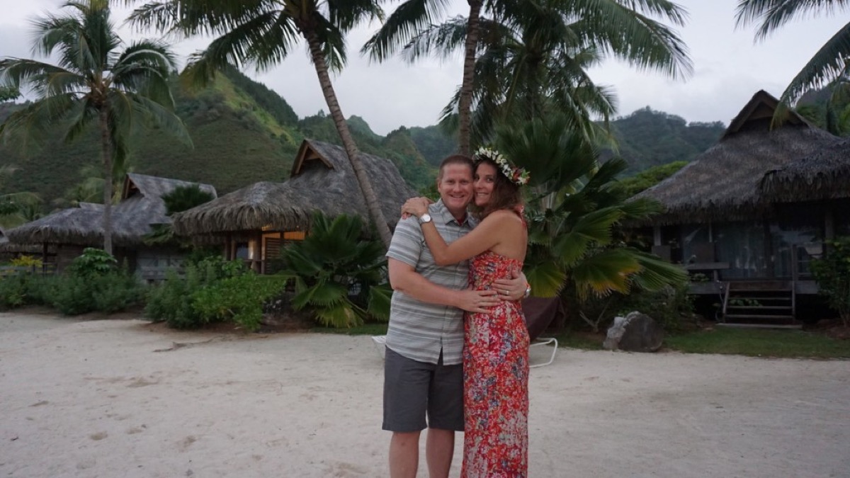 Kyle and Kate at a luau in Moorea with a flower crown