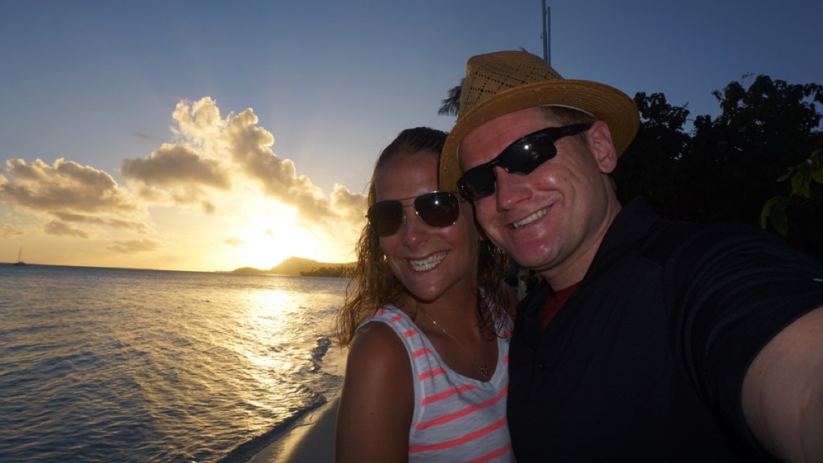 Kyle and Kate selfie on the beach at sunset in Tahiti