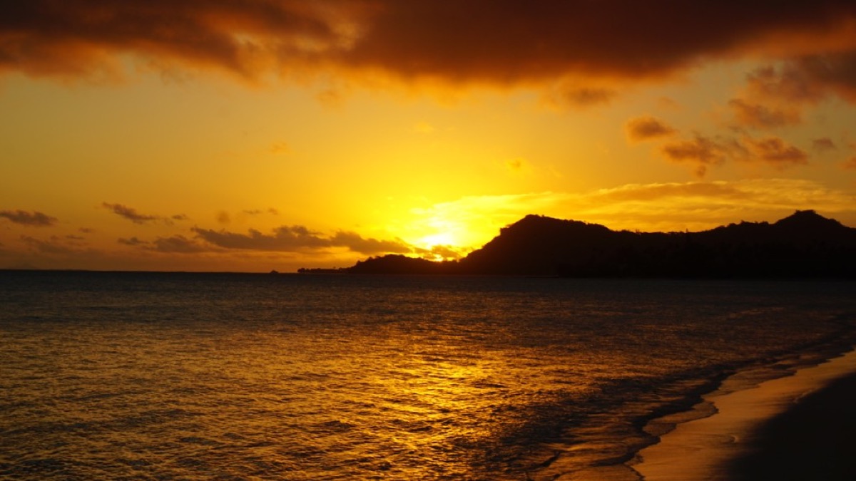 Dramatic sunset over the water in Tahiti