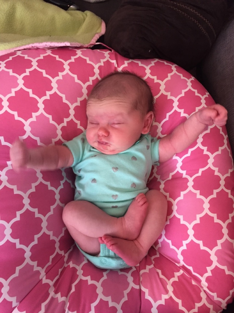 Newborn Makena on a pink pillow