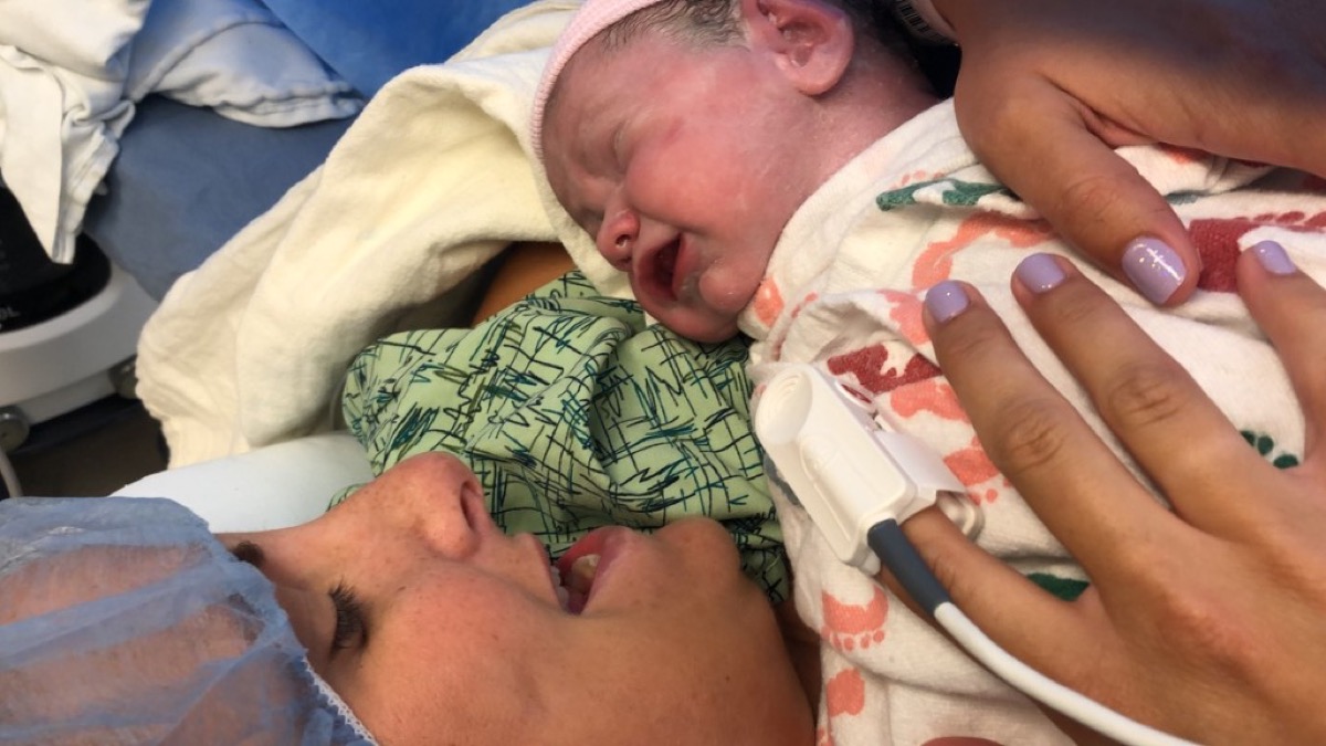 Kate holding newborn Morgan skin-to-skin in the hospital