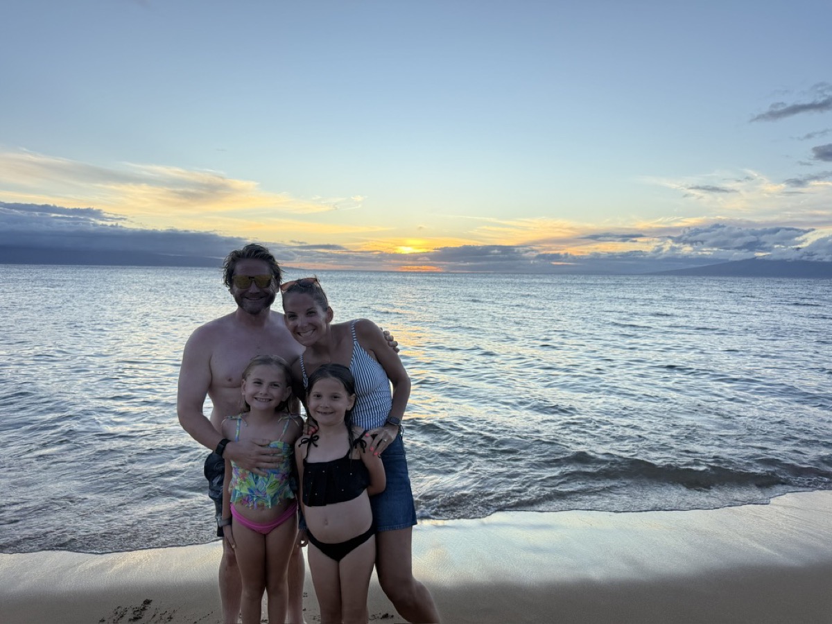 The Matthies family on the beach at sunset in Maui